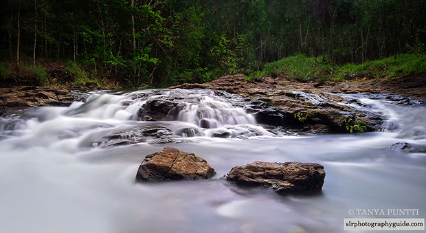 Slow motion capture - photograh cascading water over rocks.