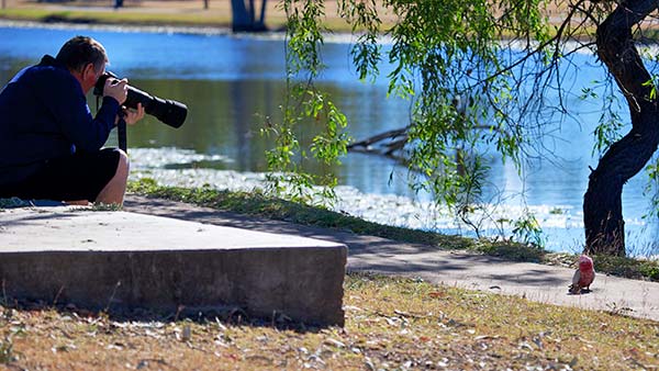 photographer with long zoom lens